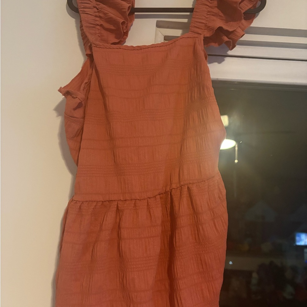 Orange ruffle sleeve top